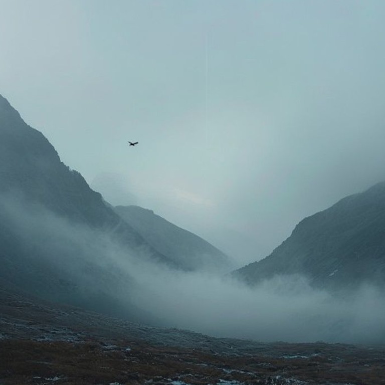 A serene mountain valley at dawn, with mist rising from the ... | ShopAyahuascaRetreats